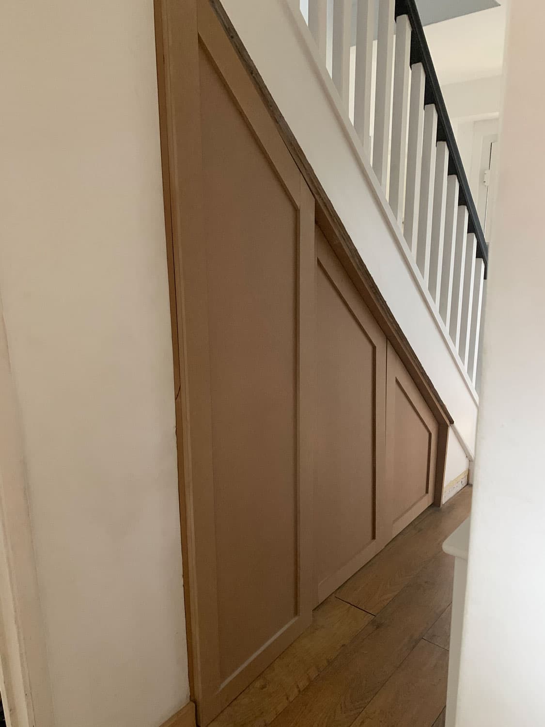 Under-Stairs Panel Storage by T Lefort Carpentry in Hertfordshire
